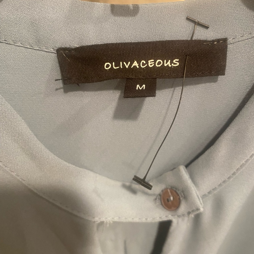 Olivaceous Romper (never been worn) Size M